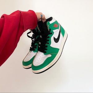 Woman’s lucky Green Jordan 1s